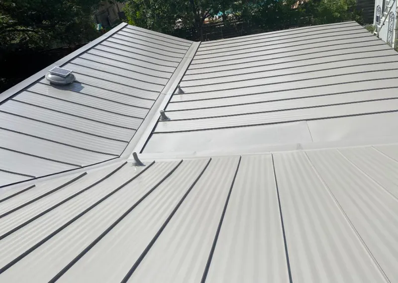 Solar attic fan installed on a metal roof for Roof Ventilation in Cheektowaga